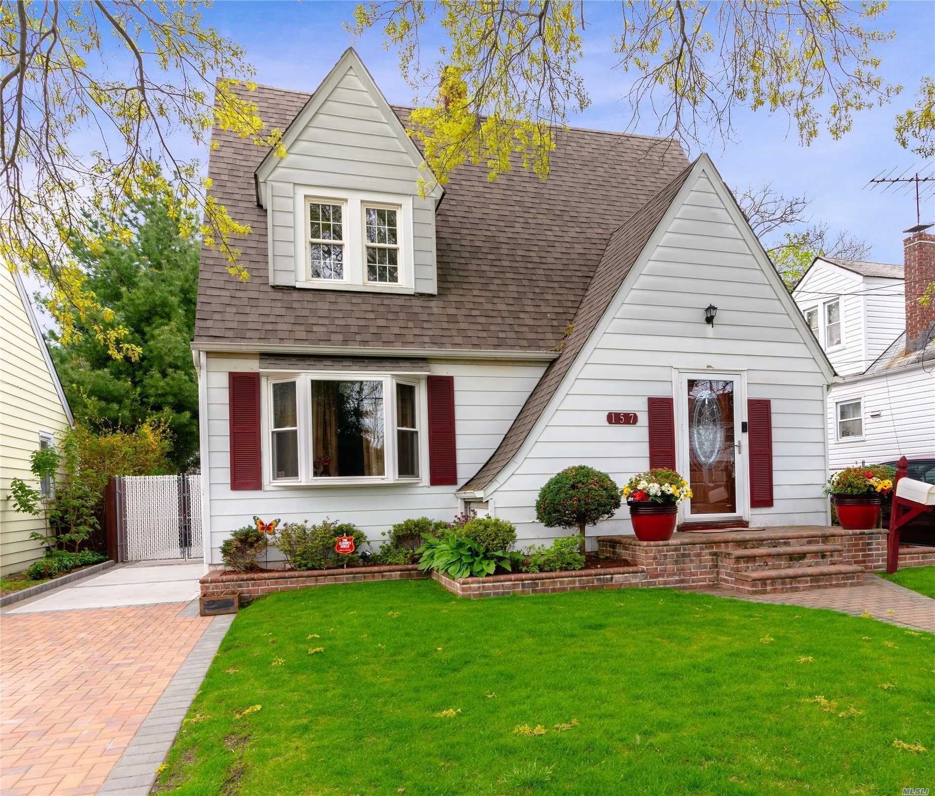 This Beautiful Tudor/Colonial nestled near to the Ingraham Estates area is in the Uniondale School District, and has many other desirable features. The LR has a wood burning FPL, & flows into the FDR which lead to the kitchen, & then out to the fabulous deck & backyard. H/W flooring throughout , 2 zone heating, 220 Amps electric, 7yrs young roof, Gas Heat & a finished basement are just some of the additional amenities that you will find in this perfect starter home or downsizing perfection.
