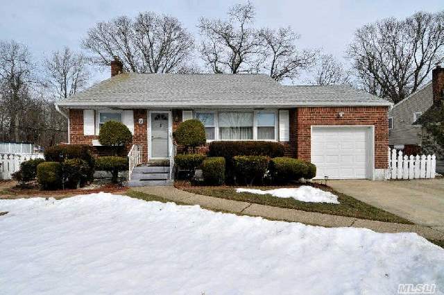 Lovely Maintained Split W Dramatic Cathedral Ceilings In Lr-Updated Windows-New Ground Level Bath-Att Gar W Full Sized Room Behind The Gar Can Easily B Converted To Living Space-Oversized Parklike Prop All Situated On Circular Block With No Thru Traffic-Conv To Neighborhood Park And Schools-Clean As A Whistle-Move Right In This Immaculate Home! One Owner Lic Nys Re Broker.