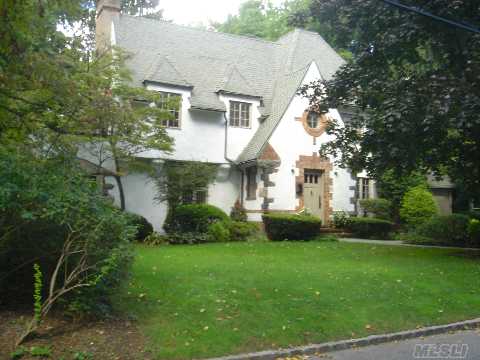 This Picture Perfect All Renovated & Tastefully Decorated 3-Story Tudor Features Beamed Ceilings & Architectural Details Thru-Out. Living Room With Fireplace, Formal Dining Room, 2 Dens Opening On Lushly Landscaped Backyard. A Chef's Eik, 4 Brs, 3.5 Baths, Basement & Attached Garage. Move-In Ready!