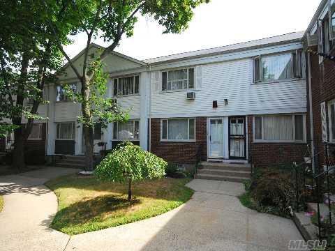 Unique Opportunity. Renovated Duplex In Bay Terrace. Just Like A House - Spacious Living Room And Dining Room. Hardwood Floors Throughout. Attic - Storage. Apartment In Excellent Condition. Private Patio. Near Shops And School. Walking Distance To Express Bus To N Y C. May Closing*