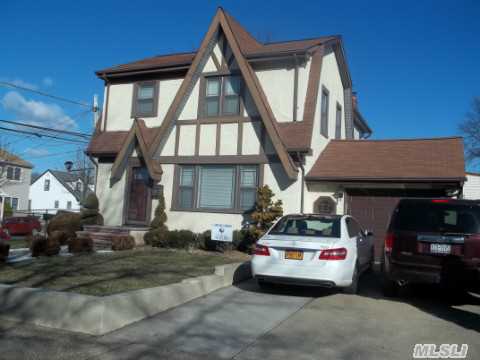 Outstanding English Tudor Colonial Expanded Upstairs And Down. Gas Grill From House Attachment. New Stainless Steel Washer And Dryer (Gas). 5 Ton New Cac Unit. Large Spacious Home With Great Backyard. Park Section. Near All Schools And Long Island Railroad.