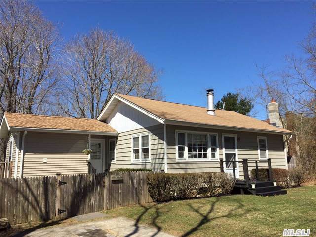 Charming Beach Cottage In Sought After Greenport Neighborhood. This House Is On A Beautiful, Tree Lined Street In The Gull Pond Beach Community. The Beach Is Two Blocks Away But The Village Is Only A Short Walk Away - Giving You The Best Of Both Worlds. The House Is Set On A Fenced In, Double Lot With 2 Patios. Rose Of Sharon's Line The Fence And Are Stunning In Season.