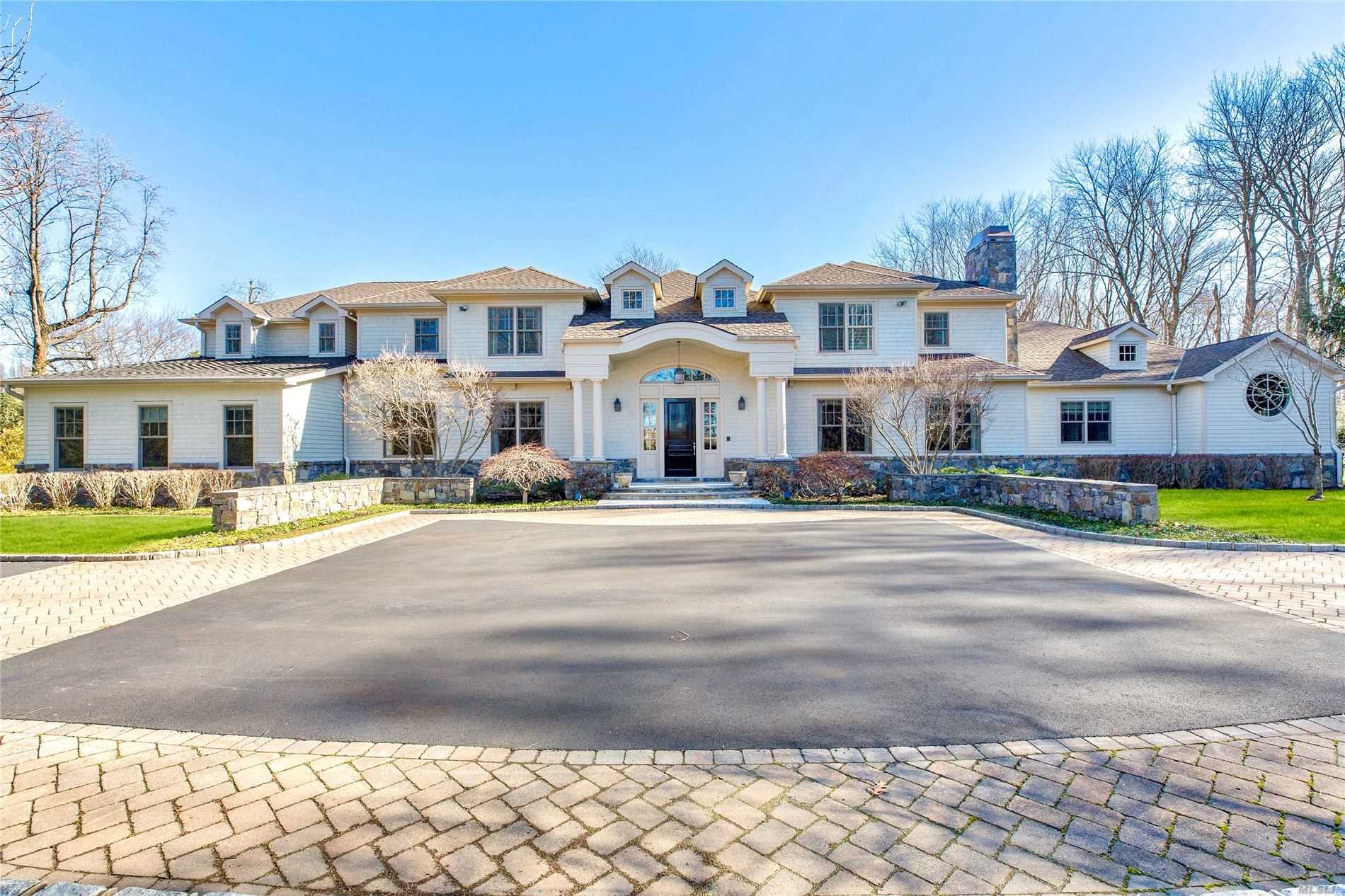 6 Harriman Drive is an architectural gem in the prestigious Village of Sands Point. Situated on 2+ acres of park-like property, this beautiful New England style colonial features a private driveway, in-ground pool, Har-Tru tennis court, multiple outdoor entertaining areas and more.