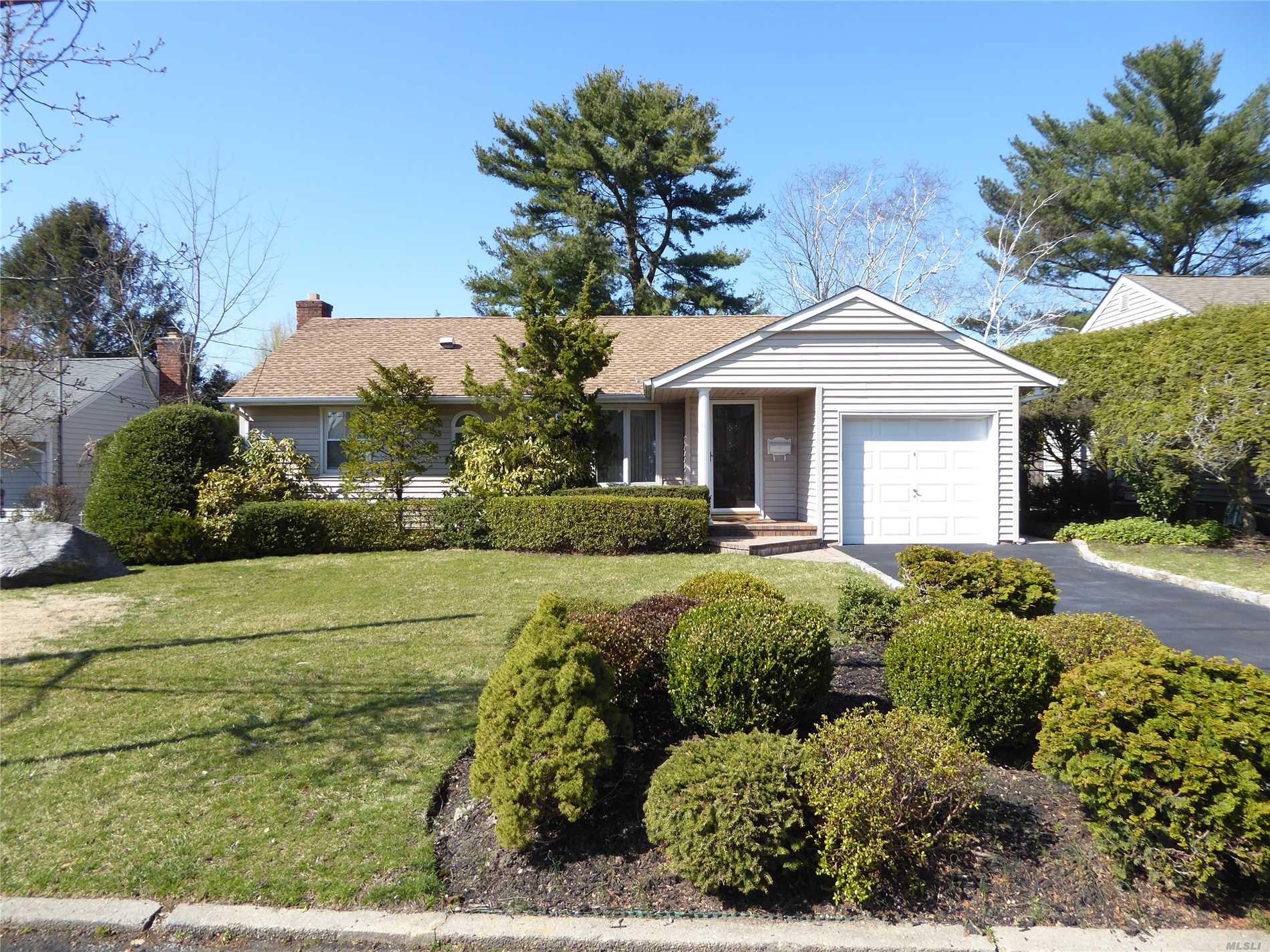 Meticulously Kept Mid-Block Home in the Hill Terrace Development. Gleaming Hardwood Floors. Beautiful Kitchen with Updated Appliances and Cabinets abound. 2 Skylights Provide Natural Light. Sliding Glass Doors to a Large Outside Trex Deck & Yard with an Enclosed Screen Porch. Full Finished Basement set up as an Office & a Large Den/Family/TV Room. New Roof. Gas Stove & Water Heater, CAC. Top Rated North Shore Schools! 5 Minute Walk to LIRR. Close To Beach, Highways, Shops & Dining.