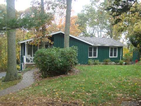 Great Location In North Shoreham 'Soundview Acres'. Walking Distance To Private Beach On Li Sound. Open Floor Plan W Cathedral Ceilings & Wood Floors. Lr W Wood Burning Stove. An Above Grade Legal Accessory Apt. Situated On A Private Wooded 3/4 Acre W 2 Large Decks. Newer Roof, Windows, Furnace & Appliances 