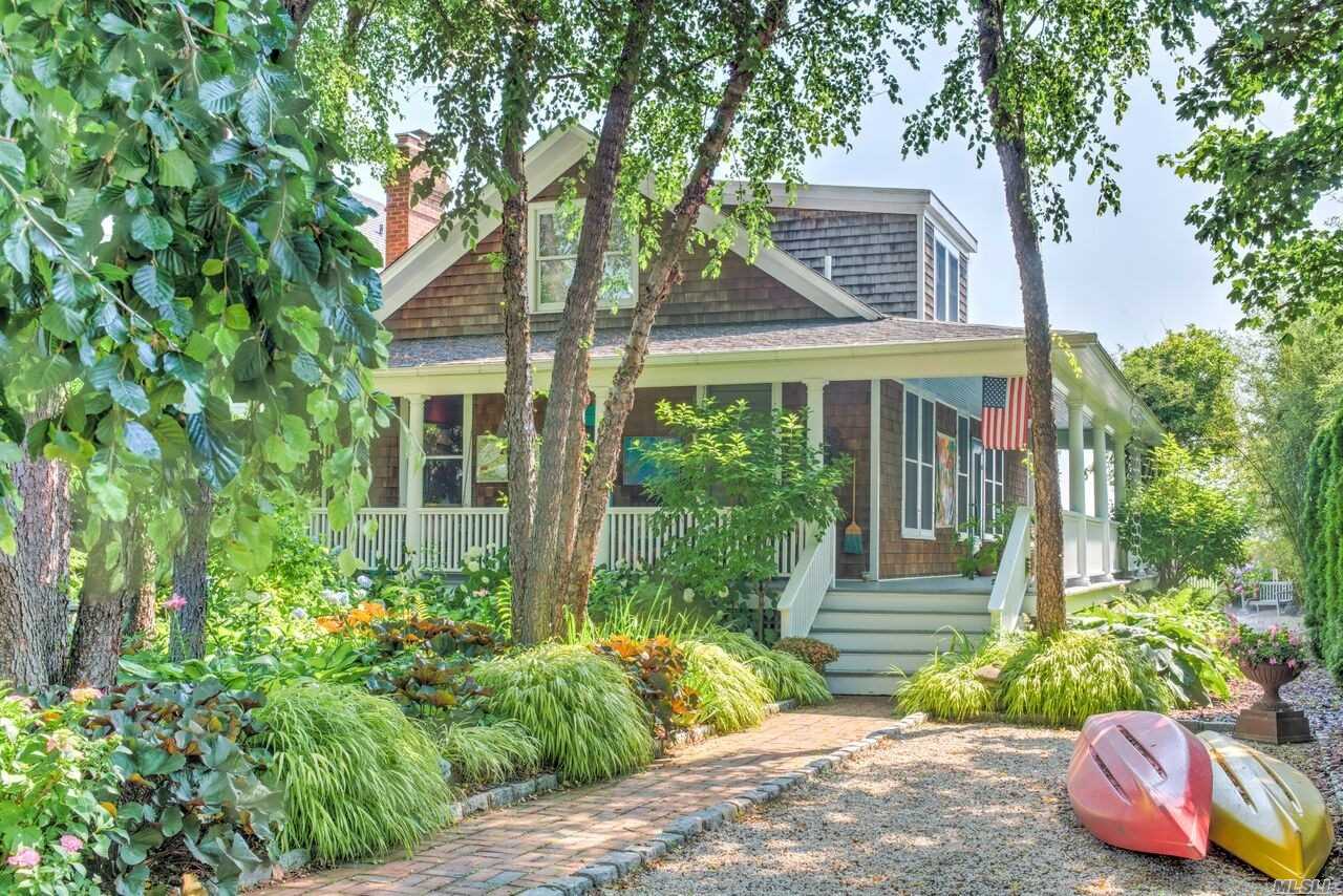 Unique & Chic: This 2 Bed/ 2Ba Beach Cottage Has Been Completed Renovated To Show Off Vast Views Of The Peconic Bay From Every Level. Master Suites Up & Down.. Living Room W/Fireplace. Wrap-Around Deck W/Hot Tub & Outdoor Shower On Waterside. Beautifully Landscaped For Privacy.