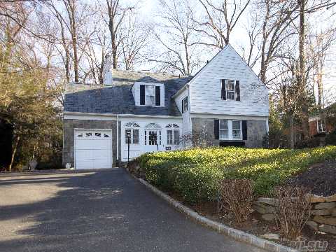 Impressive Center Entrance Colonial Welcomes You To Living Room With Fireplace, Eat In Kitchen, Dining Room, Den, Guest Powder Room, Master Bedroom With Master Bath, Two Additional Bedrooms,  Two More Full Baths, Finished Playroom, Office And Much More.  Easy Access To Plandome Train Station, Munsey Park School. Must Be Seen!