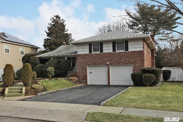 Lovely Woobury Hills Split Level Home With Extended Eik W/New Stainless Appliances;French Doors To Wood Deck;Beautiful Hardwood Floors; Updated Baths;Bonus Lower Level Guest Area;2 Car Garage;Syosset Schools.