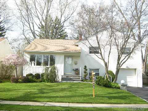 Custom Expanded Split Level Home With Southern Exposure.  Gorgeous Oversized Property With Wrap Around Deck. This Beautifully Appointed Home Offers Many Updates To Include Andersen Windows, New Roof, Updated Kitchen, Bath & Cac. Located In The Heart Of Syosset Sd#2. This Home Is A Must See!!!