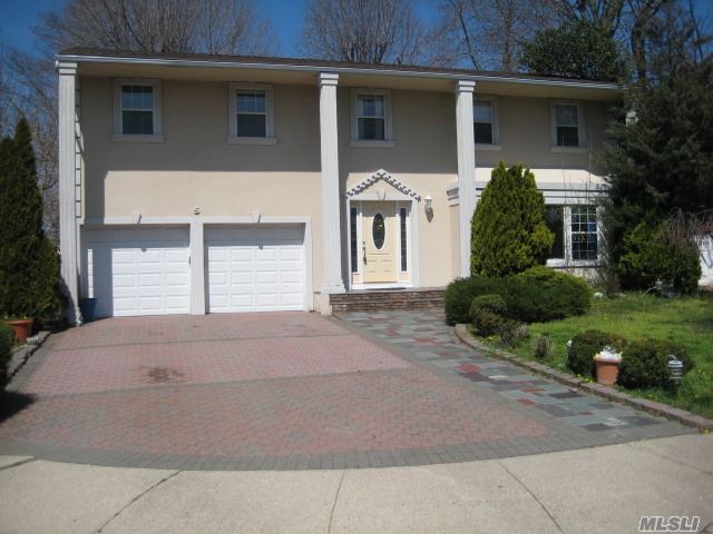 Spacious Colonial On A Cul De Sac Featuring 4 Bedrooms, 3 Full Baths, Formal Dining Room, Formal Living Room, Huge Eat In Kitchen Open To A Large Den With A Wood Burning Fire Place, Finished Basement & Central Air & A 2 Car Garage. Located In North Syosset Steps Away From The Train, Award Winning Schools & Shopping. Tons Of Potential!