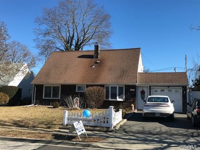 Expanded Cape Set On Oversized 60 X 131 Lovely Property In North Shore Schools. One Of A Kind Partly Fin Basement Not Common For This Development. Eik W Bay Window, Large Formal Dining Room, Spacious Sun Lit Living/Family Room , Great Flow For Entertaining. Dormered 2nd Floor With 2 Large Bedrooms -Joined By A Comfortable Sitting Room/Den, Full Bath, 2 Tiered Wood Deck, New Pvc White Fence, 4 Zone Igs, Many Nice Updates, Will Need Some Tlc, Sold In As Is Condition, Wonderful Opportunity !!