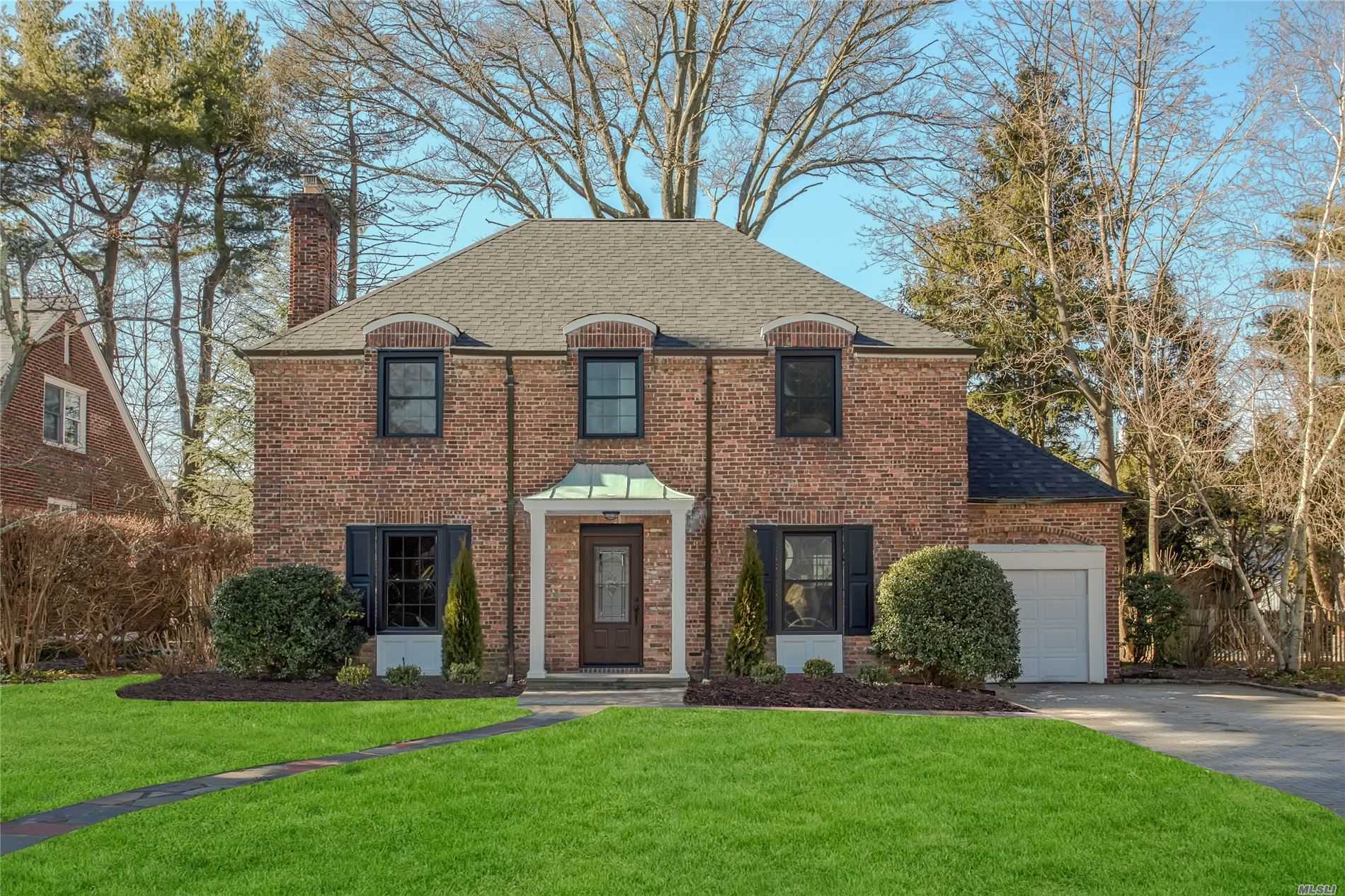 Masterfully crafted, experience pure luxury living in this completely remodeled center hall brick colonial. This residence boasts a new kitchen outfitted with Viking appliances and 6-burner stove, new bathrooms including a luxurious master bath, custom closets throughout plus a newly added rear extension. New roof, new windows, new two zone HVAC systems, 2nd floor washer & dryer, LED lights throughout all saddled on a flat 74x100 lot. Short distance to LIRR platform, town & middle/high school.