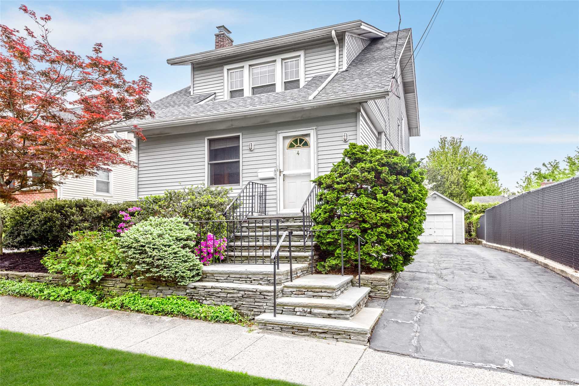 Spacious and open, this 3-bedroom, 2-bath Craftsman Colonial, in the desirable Park section of Port Washington, is a place to call home. A wide entry way leads you into a nicely scaled livrm w/high ceilings, abundant dining room and an Eik with views of backyard. Upstairs, 3 large bedrooms with full bath and walk-up attic make the home very comfortable and offer beautiful architectural details. Basement, laundry & storage. Close to all; 0.6 miles to PW LIRR. Guggenheim, taxes reduced <$15, 000