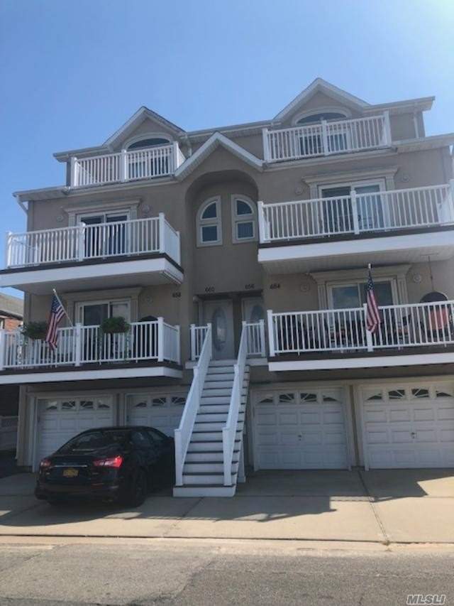 GORGEOUS 2 STORY CONDO CLOSE TO THE BEACH AND BOARDWALK FEATURES AN OPEN FLOOR PLAN, A MASTERSUITE WITH FULL BATH W/ JACUZZI, 2 MORE BEDROOMS, FULL BATH, LR W/ FIREPLACE, DR , EIK, FULL BATH, AND 1 CAR GARAGE!