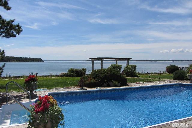 Sublime Peconic Bay-Front Residence With Playful View To Shelter Island And Beyond... Rarely Does A Home Of This Calibre And 'Location' Become Available.  Waterside Pool,  Fabulous Exterior Entertaining Spaces - Only One Neighbor - Assures Privacy!  In Addition To Your Private Waterfront Oasis - Association Beach And Dock... Large Home In Great Condition Awaits You!
