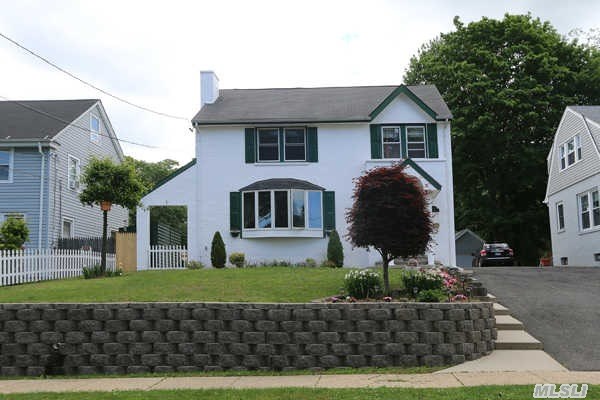 Beautiful Four Bedroom Stucco Colonial,  Lovingly Renovated!  Corian Kitchen With Recessed Lighting And Grohe Fixtures.  Two Brand New Baths.   All New Plumbing And Electric System.  Central Air.  Better Than New!  Formal Dining Room With French Doors Leading To Rear Deck.  Full Finished Basement.  Just Pack Your Toothbrush And Move In!