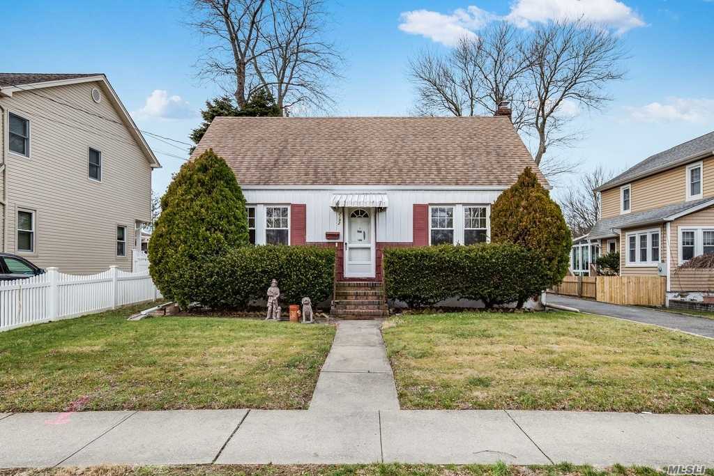 Cape Cod Style Home Features Hardwood Floors, 4 Bedrooms, 1 Bath, Great Expansive Yard! Gas Stove, Hot Water & Dryer! House Being Sold In As Is Condition. Award Winning Seaford Schools! Near Major Highways & Transportation & Parks