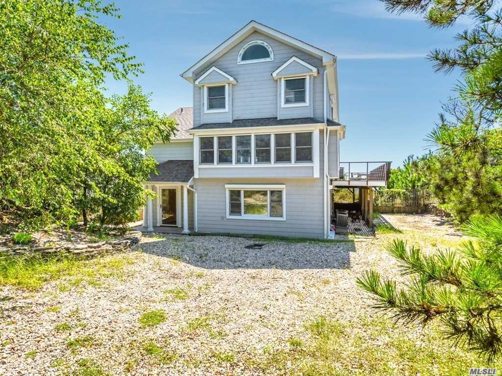Perhaps One Of The Most Desirable And Sought After Locations In The Oak Beach Association. 108&rsquo; f Bulkhead With A 68&rsquo; Pier With Dual Boat Slips And Boat Lift. 6&rsquo;-8&rsquo; Of Water At Low Tide, So Bring Your Big Boat ! This Tri-Level Beach House Boasts Countless Upgrades. You own the sunrises and the sunsets ! Fire Island Without The Ferry ! ! !