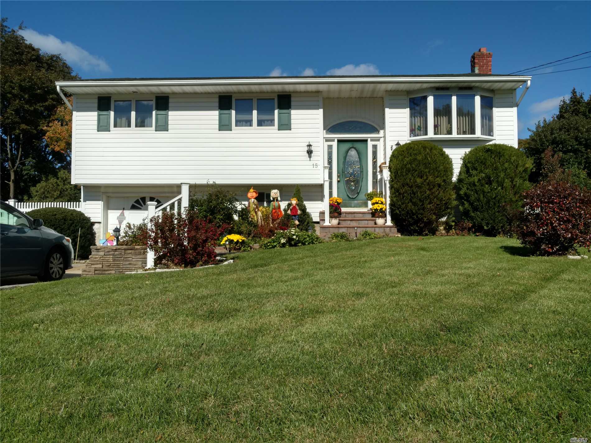 Beautiful Hi-Ranch In A Very Desirable Central Islip Neighborhood. Fantastic Curb Appeal, With New Pavers And Hard Scape Planters. Large House With Tons Of Potential For The Extended Family. Shed Is 1 Year Old And A Gift, New Composite Decking With Back Yard Access, A Must See. Home Won't Last.