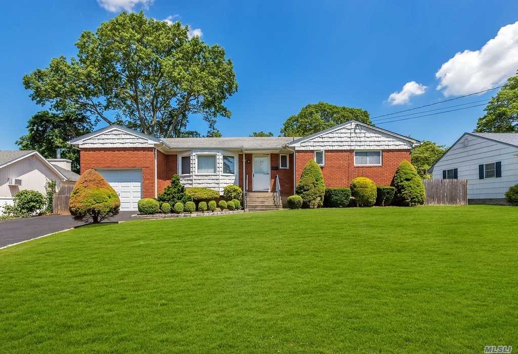 Beautiful Clean & Bright Custom Built Ranch. EIk w/ Maple Cabinets, Newer Windows, Roof, Patio, Appliances, Nice size Rooms, Wood Floors Under Carpets, Ductless CAC, Updated Electrical (2015), Islip Schools all nestled on Landscaped Fenced Property