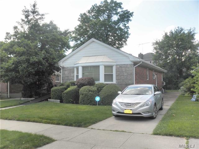 Solid Brick House With The Stone Front. 3 Bedrooms, 2.5 Baths, Formal Dining Room, Eat In Kitchen, Hardwood Underneath Carpet. Southern Exposure Sunny House ! Private Long Driveway. Top School District #26. Very Quiet Block And Convenient Transportation, Q27 Bus To Flushing!