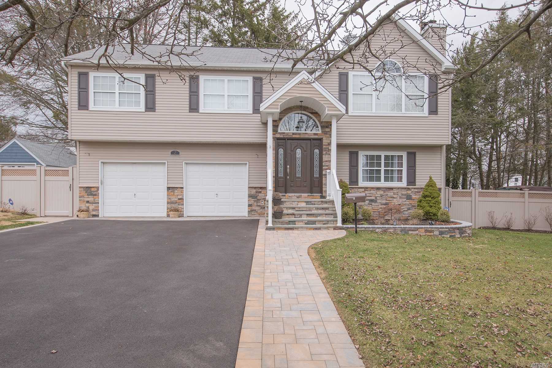 Move Right Into This Magnificent Custom Built High Ranch, Featuring 2 Fireplaces, Full Finished Basement, New Eik, Bathrooms, Hardwood Floors. Private Backyard With Paver Patio Perfect For Entertaining, Close To Shops, Restaurants And Lirr Too Much Too List, A Must See!