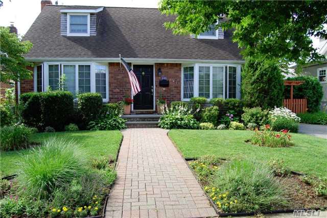 This Beautiful Wideline Cape Has Been Fully Renovated Into A Spacious 5 Bedroom Home Located In The Prestigious East Williston School District, This Dormered Brick, Vinyl And Cedar Shingled Gem Features A Cook's Kitchen With Cherrywood Cabinets, Newer Appliances, Black Granite Countertops And A Solid Copper Backsplash.