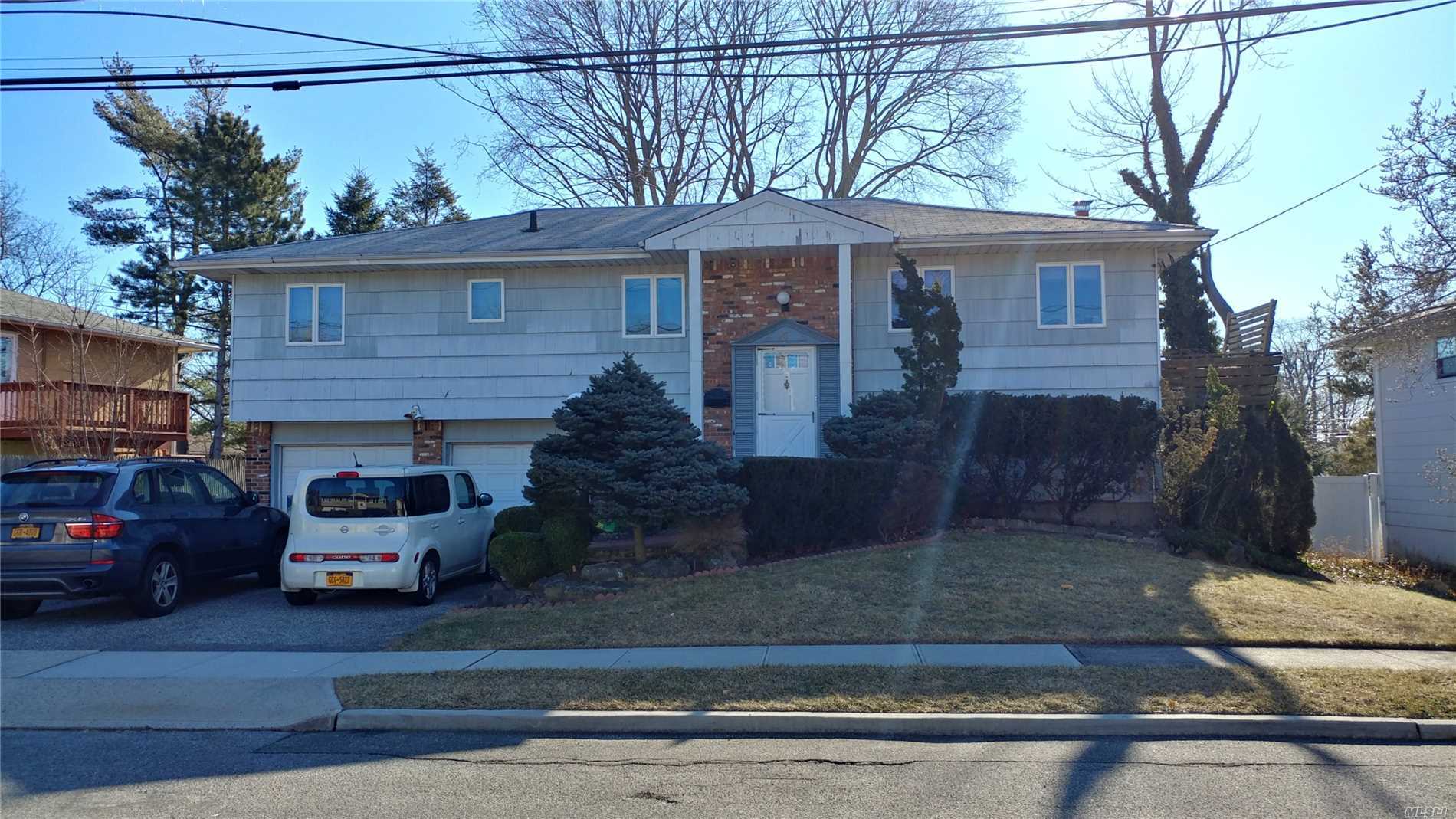 4 Br 2.5 Bath Hi-Ranch Home In Syosset. 2 Car Garage, Cac & Forced Air Central Heating, Gas Heating & Cooking. Lot: 79 X 100, Real Estate Tax Never Been Grieved. House Needs Updating & Some Repair. Being Sold As-Is Condition.