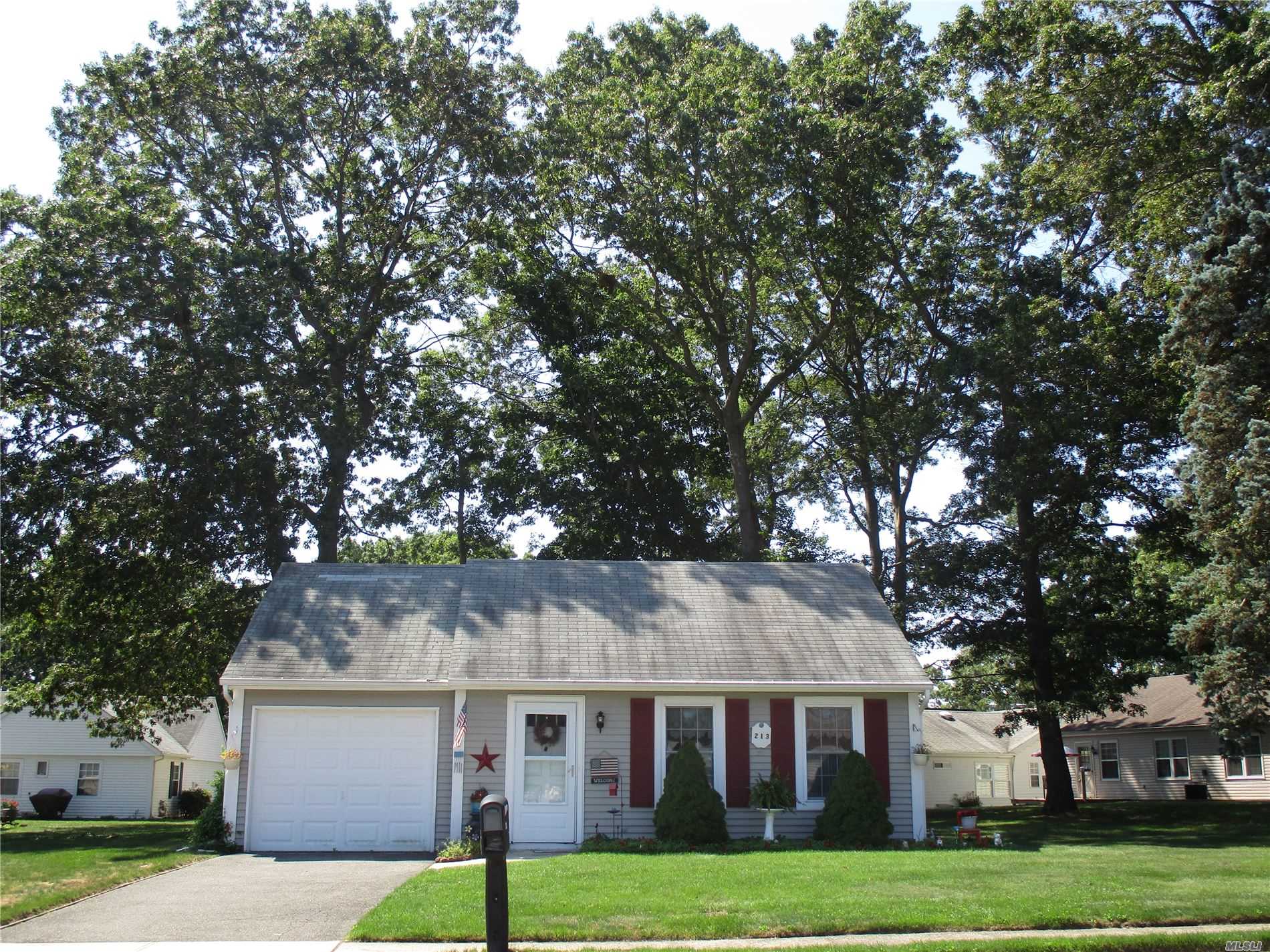 Immaculate Brookhaven with double lot, short walk to clubhouse/pool/tennis. This lovely home has updated windows, laminate floors throughout, and updated bathroom with walk-in shower. Enjoy the pretty landscape on the covered paver-patio. Sale may be subject to terms & conditions of an offering plan.