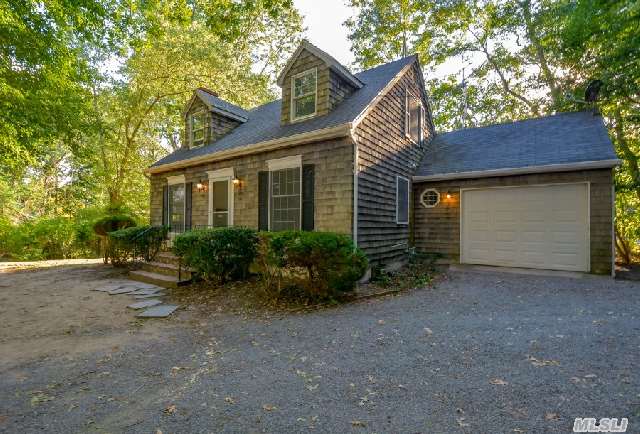 Charming Waterfront Cape On Fordham Canal Section Of Gull Pond With Access To Peconic Bay. Home Has A New Gas Boiler. Large Deck For Entertaining.  Full Basement, Oversized Garage With Basement Hatch.