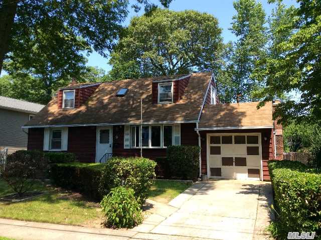 Large 4 Br,  2 Bath Cape In The Woods Area Of Massapequa On A 80 X 100 Lot! Originally The Builder's Model,  This Corner Home Is Loaded With Potential & Is In A Very Sought After Neighborhood. Great Room Sizes,  Hardwood Floors Through-Out,  Fireplace,  Garage. Large Deck & Full Basement With An Outside Entrance.