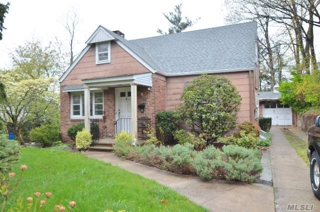 Classic Cape With A Beautifully Updated Country Style Eat-In-Kitchen, Overlooking A Large Serene Property. Four Bedrooms And Two Full Baths. Hardwood Floors Throughout! Full Basement With A Finished Area And Bar, A Well As An Unfinished Area With A Workbench, Utilities, And Laundry. One Care Detached Garage. Glen Cove Beach Rights.