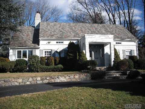 A Circular Driveway Leads To This Beautiful Charming Cape.  Located In A Cul-De-Sac Featuring Wood Floors And An Open Floor Plan.  Situated On A Flat Acre Property In One Of Kings Points Most Prestigous Communities.  This Home Is One Of The Few Connected To The Sewer System In Kings Point.