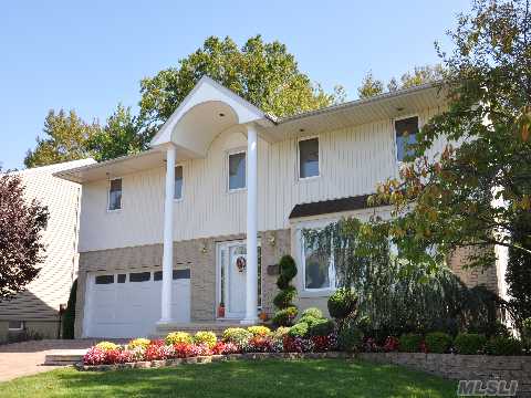 Great X'large Colonial Facing North At The Best Section Of The Carriage Homes In Searingtown District; X'deep Property W/30'Yard Easement Usage;Multi Level Deck-Hot Tub-Playground- All Remodeled In Diamond Condition!New Granite Kitch-Radiant Heat' -3-Zone Cac-Hot Water H'ting-Fin Bsmnt-Alarm-Ig Sprklrs-