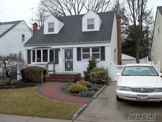 A Lovely Dormered Cape,Well Maintained,Lots Of Closets, Centrally Loc.Within 10 Min.Of All Major Highways,Walking Distance To The Lirr And Williston Park Shops.The House Has A Custom Kitchen With Solid Maple Wood Cabinets,Corian Counter Tops/Backsplash And Ceramic Tile Floor.The Mstr Bdrm Is Located On The 1st Flr With Walltowall Closets.This Home Shows Pride Of Ownership.