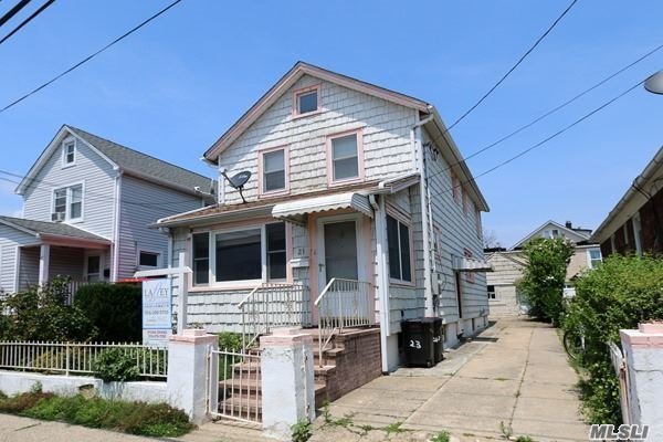 Port Washington Village Hidden Treasure! 4 Bedrooms And 2 Full Baths. Enclosed Front Porch. Outside Entrance From Driveway. Over-Sized Garage. Hardwood Floors Throughout! Use Your Imagination And Bring This 1923 Oldie To Goodie!