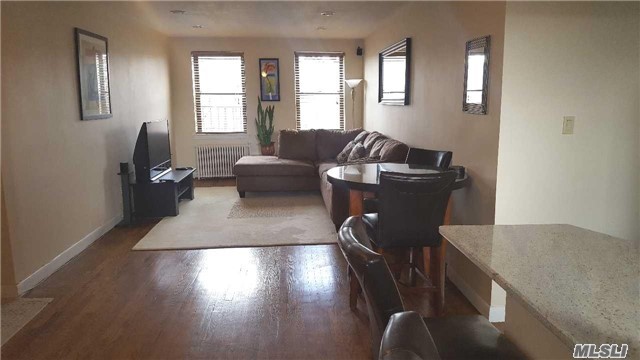 Large 1 Bedroom Unit On The Top Floor! Bright With A Large Living Room And Bedroom. Updated Open Kitchen And Updated Bathroom. Good Closet Space. Wood Floor Through Out. Close To Transportation (Buses Q27, Q12 N20 & Lirr), Shops, Restaurants And Oakland Park. No Flip Tax! School District 26. Separate Storage Space Available.