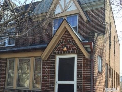 Semi-Detached Brick Colonial On Deep 23X120 Lot. 3 Bedrooms, 1.5 Baths, Full Finished Ground-Level Basement With Ose, Upper Level Skylight. Gas Heat, Dryer & Gas Stove. Elementary: P.S. 155 | Middle: J.H.S. 226 Virgil I. Grissom/Hawtree Creek | High: John Adams.