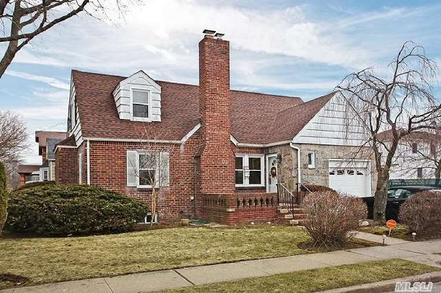 Mother Daughter Expanded Cape. 2 Kitchens & 2.5 Baths All With Marble,  Granite Kitchen Counters,  Hardwood Floors, Field Stone Fireplace, Large Deck With Stairs,  Timberline Lifetime Warrantee Roof,  Finished/Tiled Basement With Wooden Staircase,  In-Ground Sprinklers,  Newer Windows.