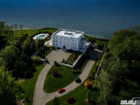 This Incredible Limestone Mansion Set On 6 Waterfront Acres Was Inspired By Marie-Antoinette's Le Petite Trianon In Versailles. A Stunning Architectural Masterpiece Beyond Compare Built Using Only The Finest Materials. Features Western Waterviews With Spectacular Sunsets.