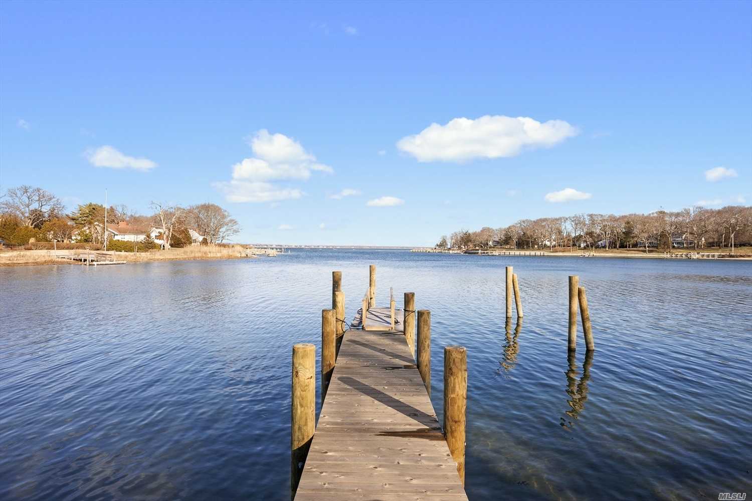 Sensational Panoramic Water Views, Offering 142.5 On Jockey Creek, With Sandy Bay Beach And Direct Passage Out To Peconic Bay. Distinguished Within Its Class, This 5 Bed, 3 Bath Traditional Home, Possesses Endless & Rare Opportunity. A 35 X15 Boat House Anchored A Shy 10 Feet From The Water & Fully Restored Bulkhead, W/Walkout Dock, Provides A 3 Ft Median Low Tide For Boating Or Fishing Enthusiast. Hardwood Flooring, 3 Fireplaces & Original Retro 1970&rsquo;S Details W/Built In Cabinetry Throughout.