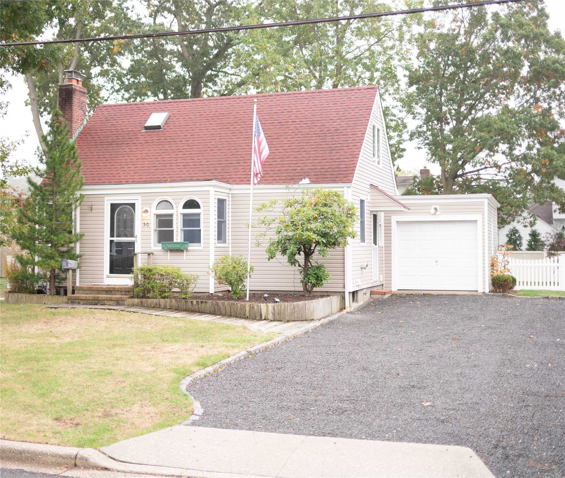 Just in Time for Fall.... Charming 3 Bedroom, 2 Bath Cape in the heart of Massapequa Woods! Perfectly set on a Quiet Mid-Block Location. Updated Eat in Kitchen and Bathrooms. Lovely Living Room w/Fireplace. Hardwood floors throughout. All on an 80 x 100 Lot! Close to Shopping, Schools, and Train. SD #23.