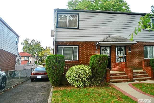 This Home Is Absolutely Sparkling Clean,  Lovingly Maintained For Years. Sun Soaked Semi-Detached Colonial Features Living Room,  Dining Room,  Kitchen,  2 Bedrooms & 1.5 Baths. House Has A Bone Dry Finished Basement With Laundry Room. Close To Transportation,  Shopping & House Of Worship. School District 26,  P.S. 162 & M.S. 158.