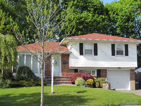 Opportunity Knocks!Welcome Home To This Brick/Vinyl Split Set On A Lovely Residential Block!Curb Appeal Includes  Replaced Windows, Extended 2 Car Driveway, Great Yard With Lush Lawn,Deck, & Storage Shed.Interior Features Comfortable Lr & Dr, Skylit Eik, 3 Bright & Airy Brs, 2 Full Bths, Den & Exercise Rm, Plus Finished Bsmt With Playroom & Laundry.Baylis Elem/Thompson Ms 