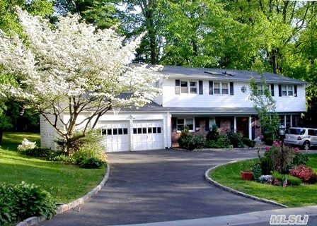 Flower Hill Colonial On .53 Acre.Port Wash Schools. 3/4 Brs.3 Full Baths.Expanded Designer Eik W/Cherry Cabinets,  Granite, Island, Radiant Heat, Floor To Ceiling Windows Overlooking Expansive Property.Huge Lr W/Fpl Opens To Dining Rm W/Wood Floors/Cathedral Ceilings.Fam Rm.Florida Rm/Wb Fpl/Slate Flr/Lge Windows & Door Leading To Trek Deck.Cac.2 Car Gar.Igs.Much More!