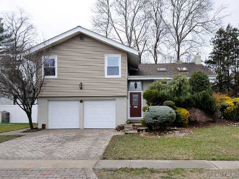 Completely Renovated 4 Bedroom/2.5 Bath East Birchwood Split. Cherry Kitchen With Stainless Steel Appliances.  Open Floor Plan. New Windows, New Walkway, New Heating System,Family Room With Fireplace. Great Midblock Location. 2 Car Garage.  Syosset Schools.