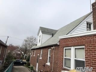 Brick Cape with room for Mom with sep entrance! 1sr floor -Large eat in kitchen, Living room, full bath, large bedrooms, 2nd living space, kitchenette, full bath, bedroom, 2 sep entrances,  second floor -2 Large bedrooms second floor,  finished basement with sep entrance, full bath, family room, gas heat laundry