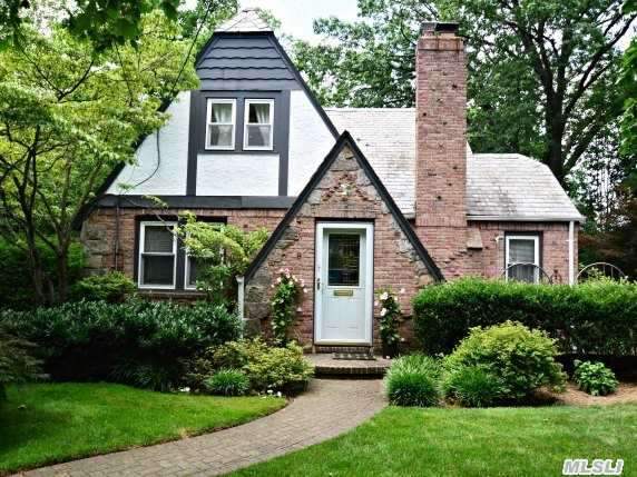 Charming And Cozy Updated 4Br,  3.5B Tudor With Master Suite On Main Floor.  Nestled In Lush Landscaping On Sunny,  Flat Property,  This Lovely Home Boasts High,  Beamed Ceilings,  Cac,  2 Zone Heat,  Fully Finished Basement With Family And Office Space.  Close To Town,  Shopping,  Restaurants,  Lirr.  Baker Hill Elementary And North Schools.