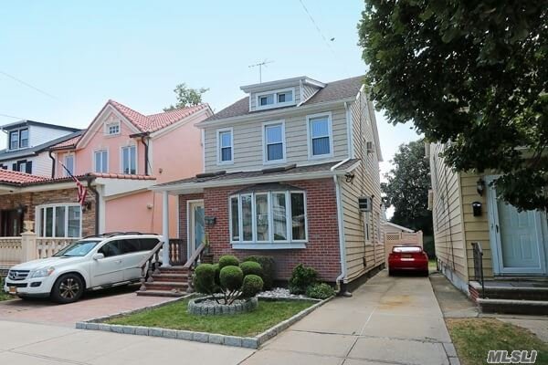 Renovated colonial with updated baths and kitchen. 4 bedrooms 2.5 baths. Stucco and brick exterior with siding. Full finished basement with full bath. New roof and siding and pavers. Close to parkways, LIRR and shopping. 1st floor is being used as a daycare but will be converted before closing.