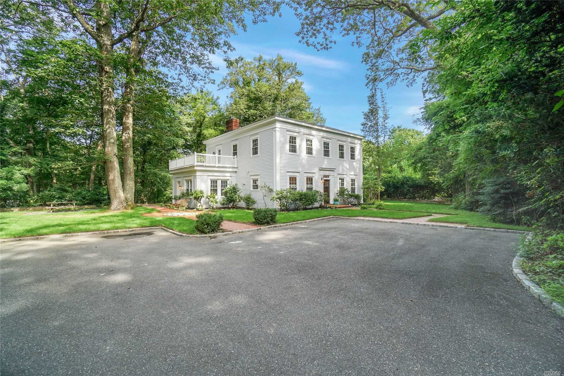 CHARMING LAUREL HOLLOW COMPLETELY renovated, sunny and spacious, gourmet kitchen, with family room with fireplace. LG, DR With high ceilings, sun room Located in the COLD SPRING HARBOR SCHOOLS. secluded and serene 3 acres. BEACH & Mooring rights, minutes to train and shopping.